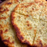 Homemade 2-ingredient cottage cheese flatbread on a wooden board