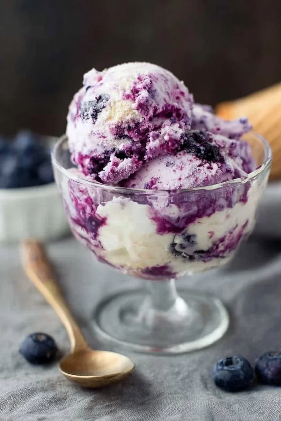 Creamy blueberry cheesecake cottage cheese ice cream in a bowl
