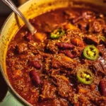 Delicious bowl of Short Rib and Chorizo Chili garnished with fresh herbs
