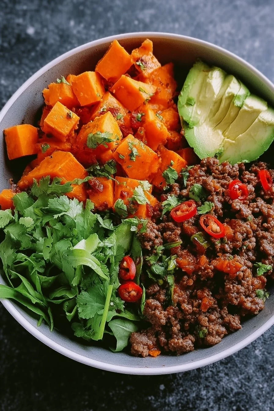 Spicy Ground Beef Sweet Potato Protein Bowl filled with nutritious ingredients.