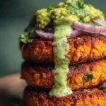 Crispy sweet potato and red lentil patties served with avocado cilantro sauce.