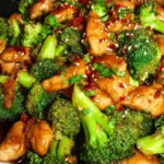 Delicious chicken and broccoli stir fry served in a bowl with vegetables.