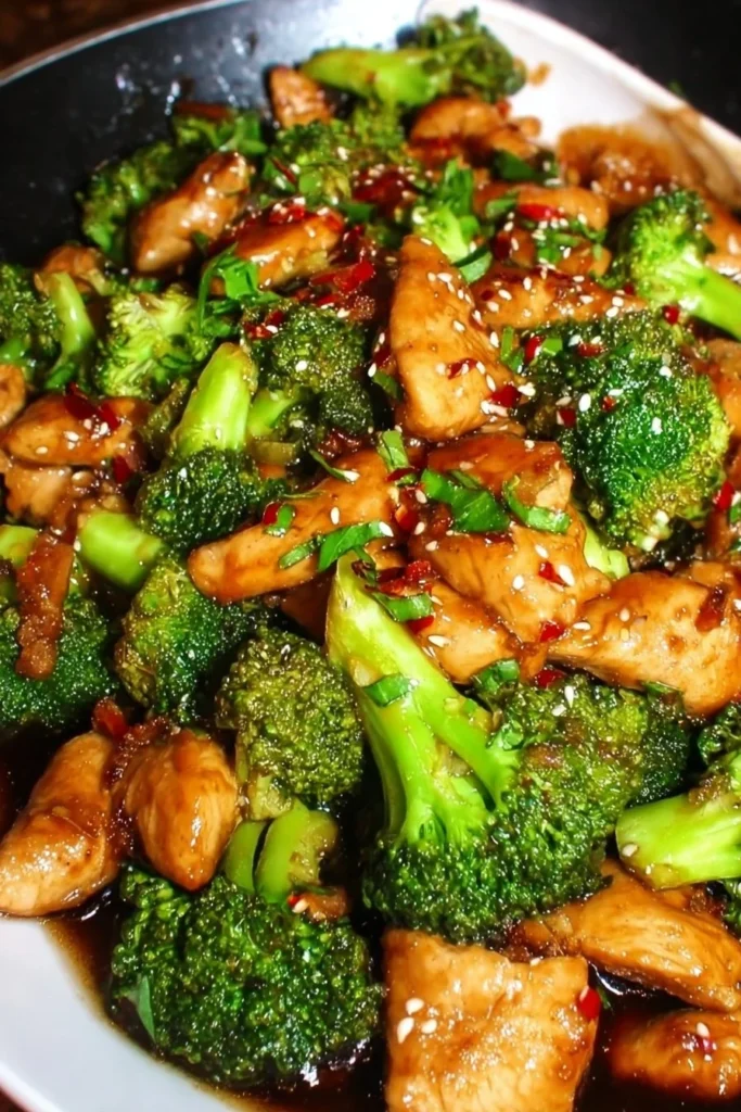 Delicious chicken and broccoli stir fry served in a bowl with vegetables.