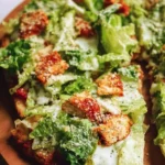 Delicious Chicken Caesar Salad Pizza topped with grilled chicken and Caesar dressing