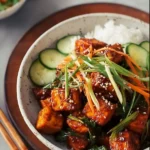 Spicy Gochujang Korean Tofu Stir Fry with vegetables in a colorful bowl