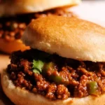 Healthy homemade sloppy joes served on whole wheat buns with fresh veggies.