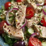 Mediterranean tuna salad with fresh vegetables and dressing