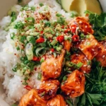 Delicious Spicy Salmon Bowls served with coconut rice and fresh garnishes